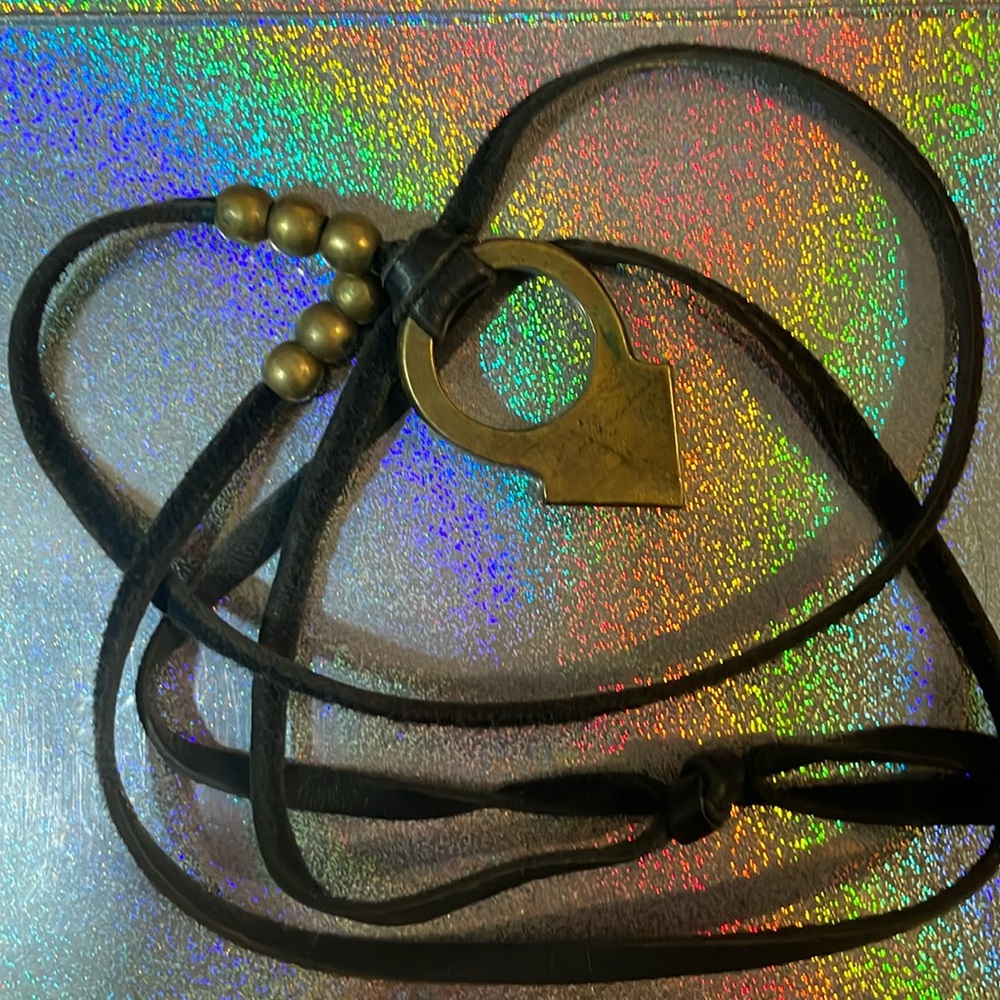 Nashville necklace. Purchased in Nashville. Brass and black leather lanyard.
